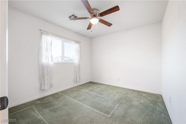 empty room with ceiling fan and carpet