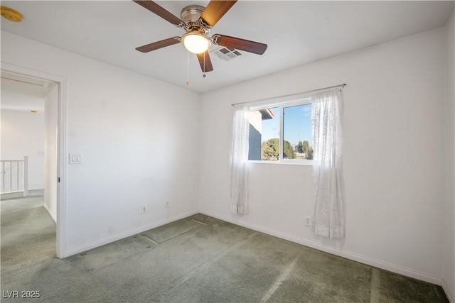 carpeted empty room featuring ceiling fan