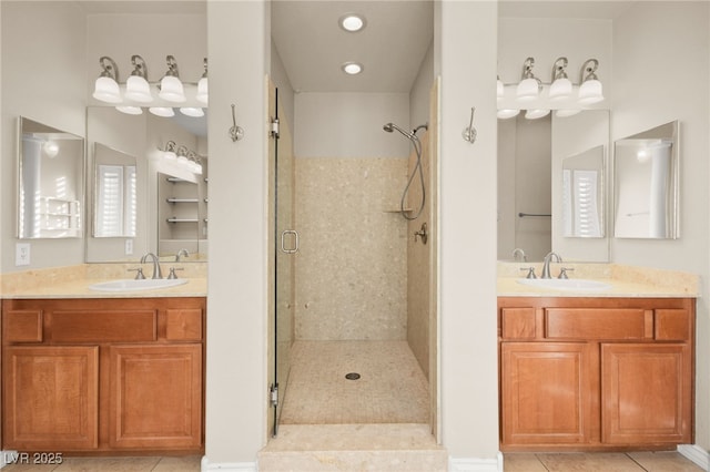 bathroom with vanity, tile patterned flooring, and a shower with door