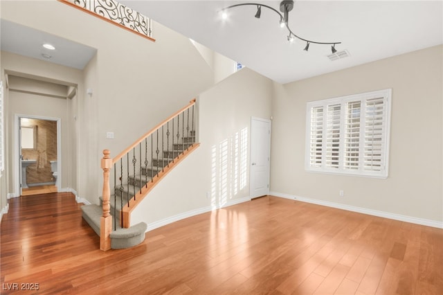 foyer with wood-type flooring