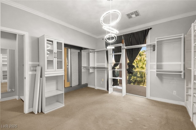 walk in closet with carpet and a chandelier