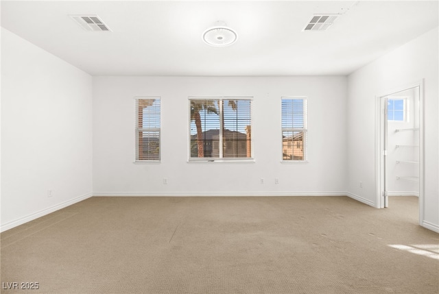 unfurnished room with light carpet