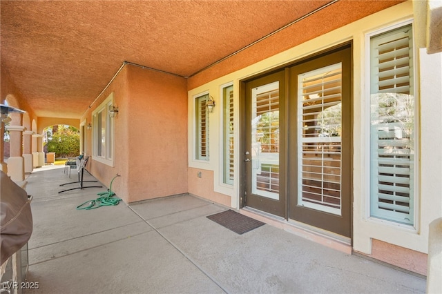 doorway to property featuring a patio