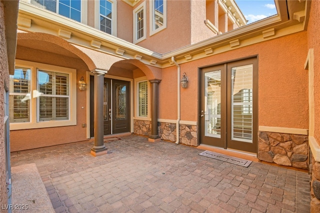 doorway to property featuring french doors