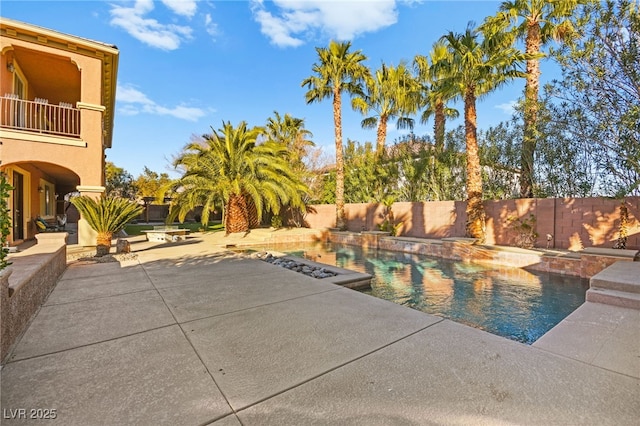 view of swimming pool with a patio