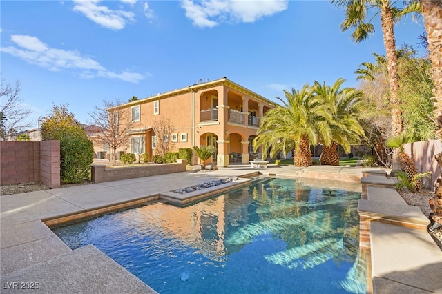 view of swimming pool with a patio area