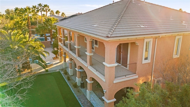 rear view of house featuring a balcony