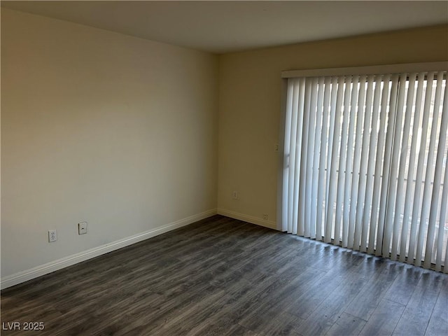 empty room featuring dark hardwood / wood-style flooring