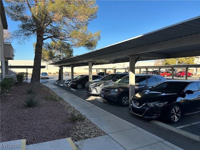 view of parking / parking lot featuring a carport