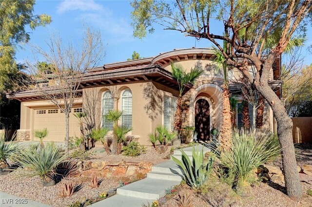 view of front of home with a garage