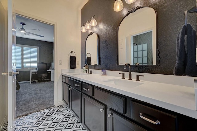 bathroom with ceiling fan and vanity