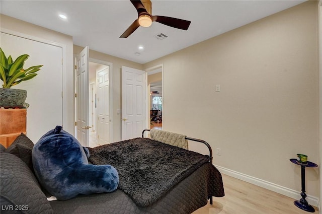 bedroom with ceiling fan and light wood-type flooring