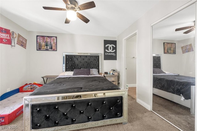 carpeted bedroom with ceiling fan