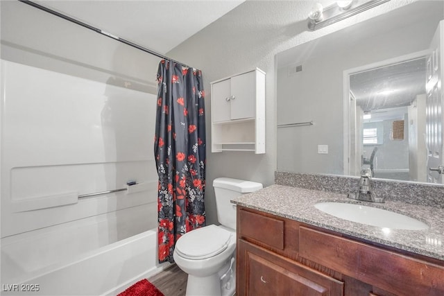 full bathroom featuring toilet, vanity, wood-type flooring, and shower / bath combo with shower curtain