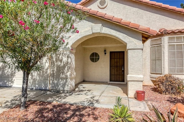 doorway to property with a patio