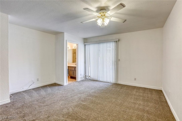 empty room with ceiling fan and carpet flooring