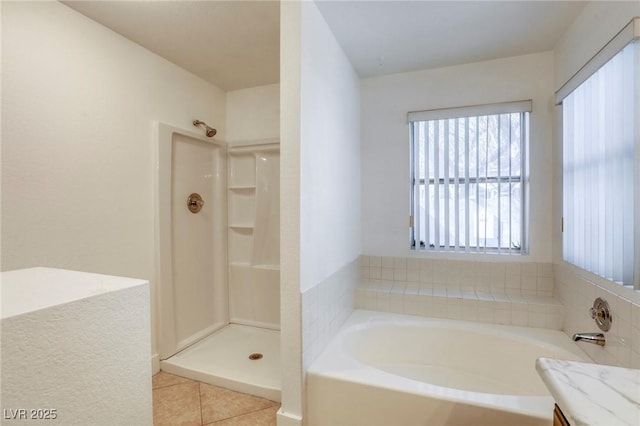 bathroom with vanity, tile patterned flooring, and a shower