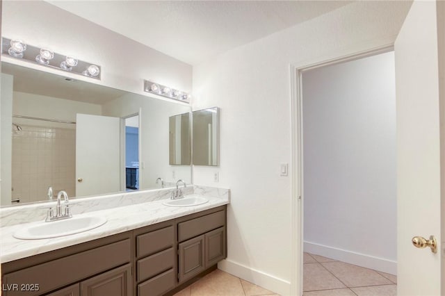 bathroom featuring tile patterned flooring and vanity