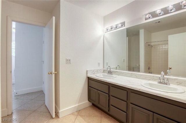 bathroom featuring tile patterned floors, vanity, and tiled shower / bath combo