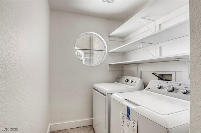 washroom with light tile patterned floors and independent washer and dryer