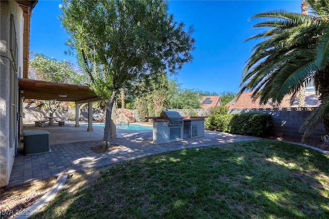 view of yard with area for grilling and a patio