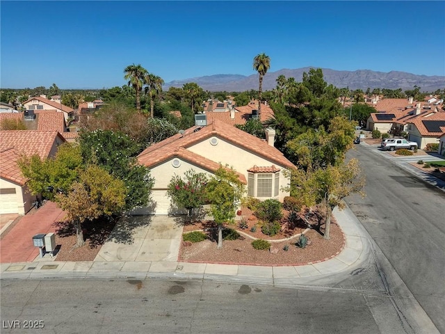 birds eye view of property featuring a mountain view