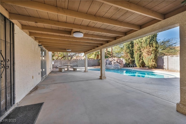 view of patio featuring a fenced in pool