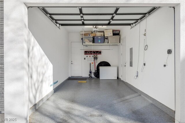 garage featuring fridge and electric panel