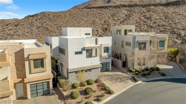 birds eye view of property with a mountain view