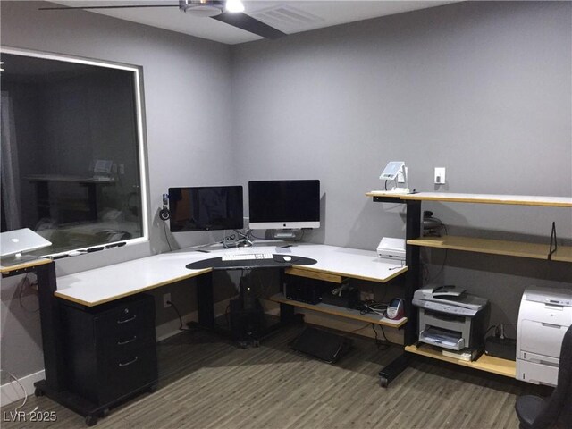 office featuring ceiling fan and dark hardwood / wood-style flooring