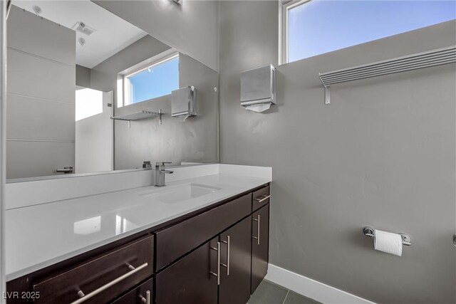 bathroom with vanity and tile patterned flooring