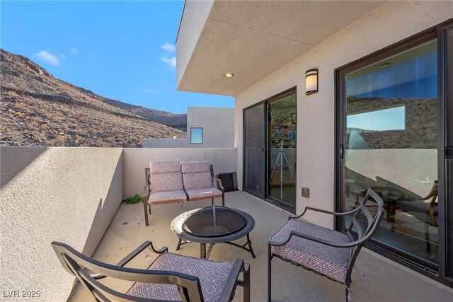 balcony featuring a mountain view