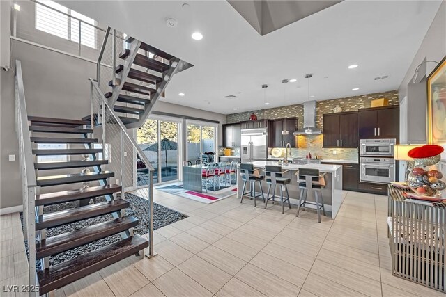 living room featuring light tile patterned floors and sink