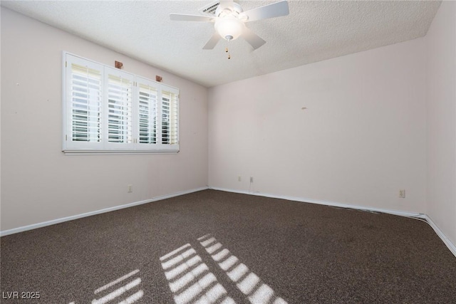 unfurnished room featuring ceiling fan, dark carpet, and a textured ceiling