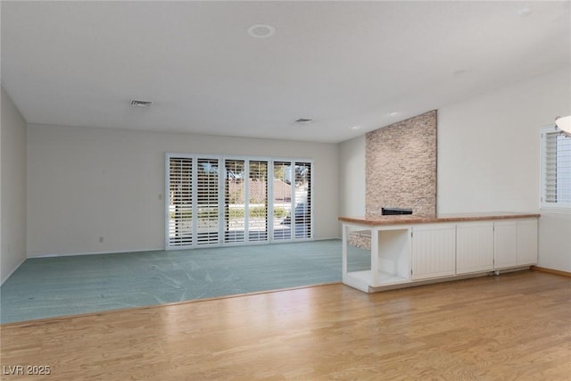 unfurnished living room featuring light hardwood / wood-style flooring