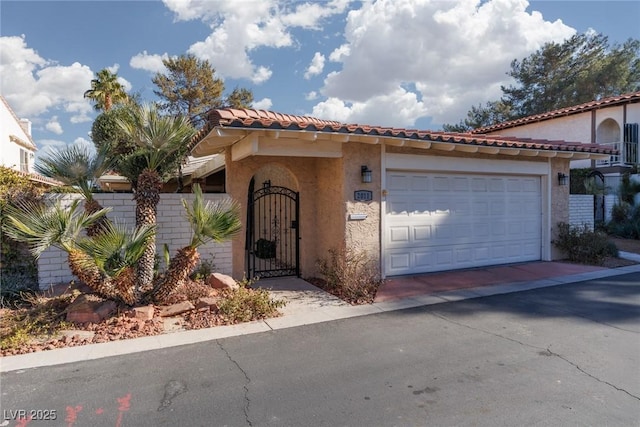 mediterranean / spanish-style house featuring a garage