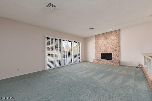 unfurnished living room with light colored carpet, lofted ceiling, and a stone fireplace