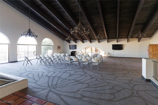 interior space with high vaulted ceiling, beam ceiling, and wood ceiling