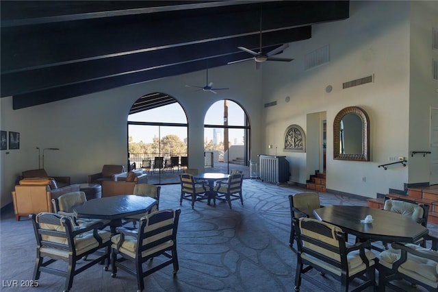 view of patio / terrace with ceiling fan and glass enclosure