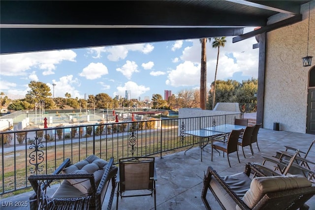 view of patio with a balcony