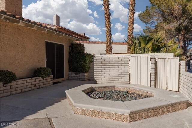 view of patio / terrace with a fire pit