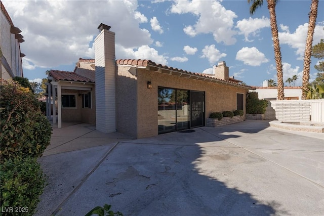 rear view of property with a patio