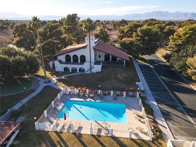 birds eye view of property with a mountain view