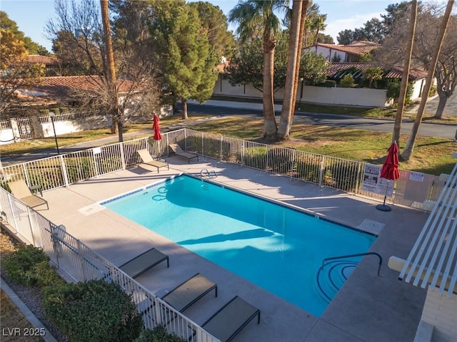 view of swimming pool with a patio