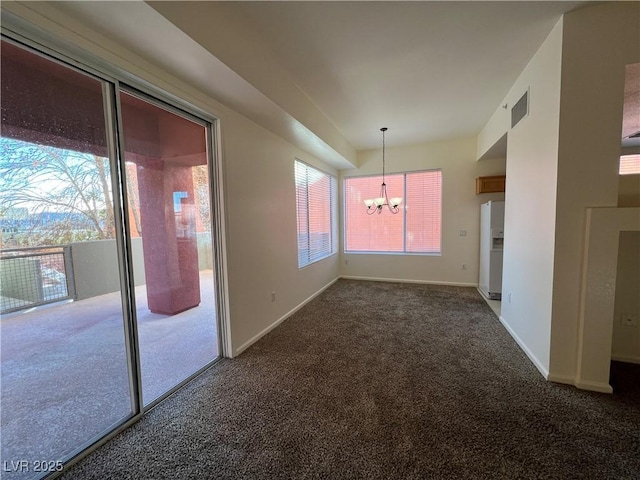 unfurnished dining area with dark carpet and a notable chandelier