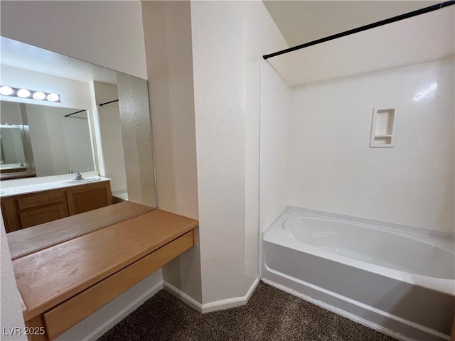 bathroom with vanity and a bathing tub