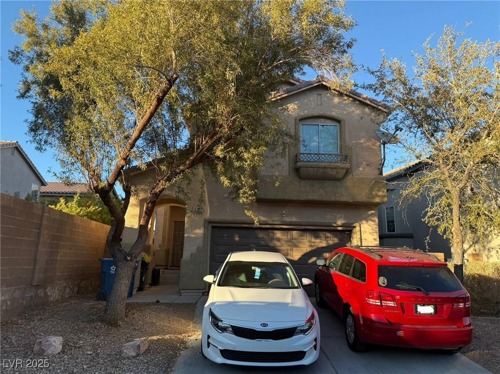 mediterranean / spanish house with a garage