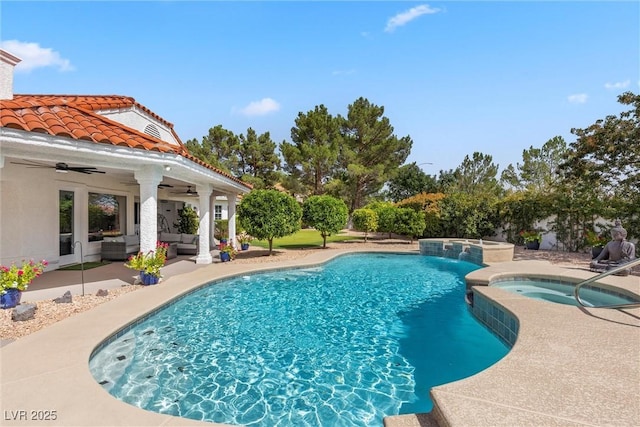 view of swimming pool with an in ground hot tub, a patio area, outdoor lounge area, and ceiling fan