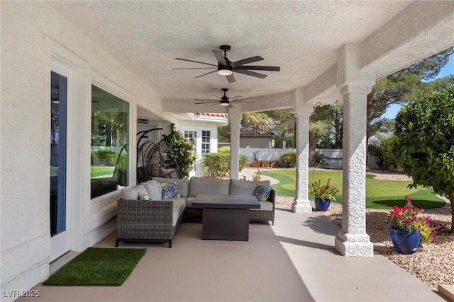 view of patio with ceiling fan and an outdoor hangout area