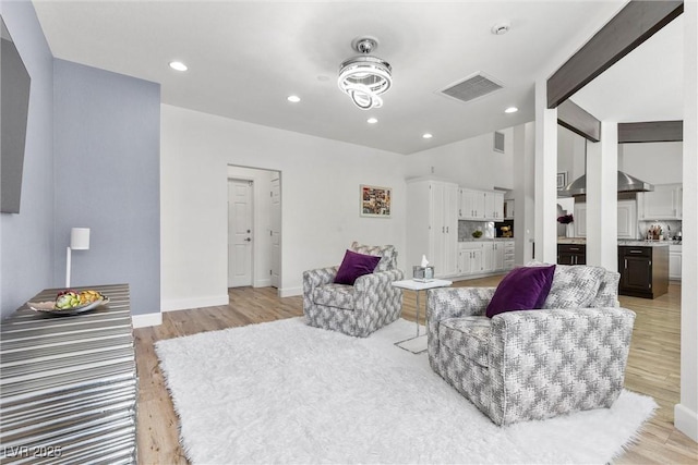 living room with light hardwood / wood-style flooring